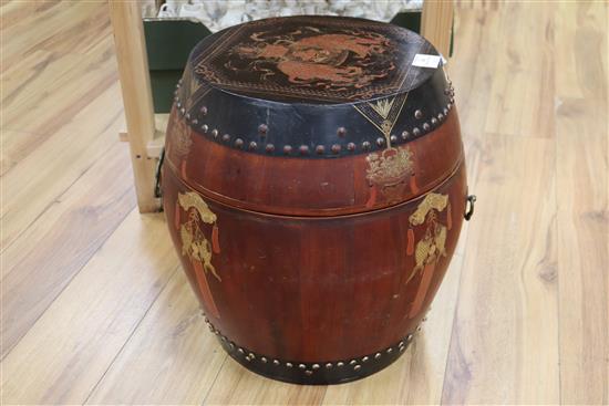 A Chinese red and black lacquer barrel shaped container